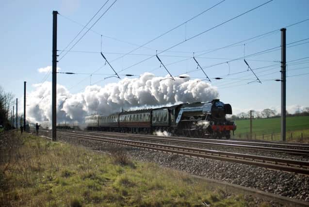 The Flying Scotsman flies again with steam belching from Ron Scrace's double chimney