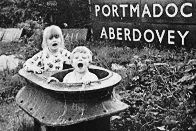 The double chimney in Ron Scraces garden at Worting Junction with  his children playing in it. It remained there for 28 years