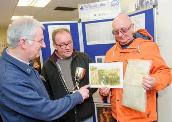 Steve Doe from Portsdown U3A, speaking with Mick Jasper and brother Roger Jasper about their grandfather Albert Edward Jasper at Portsmouth Central Library 

Picture: Allan Hutchings (160409-488)