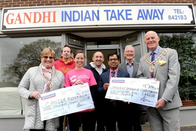The Mayoress of Fareham Anne Ford, David Bell from Fareham who is now in remission, Hayley Callacher, local fundraising manager for Cancer Research UK, Paul Richards from Richards Newsagent, owner of Gandhi's Abu-Suyeb Tanzam, Cllr Leslie Keeble and the Mayor of Fareham Mike Ford.
Picture: Sarah Standing (160624-3789)