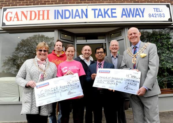 The Mayoress of Fareham Anne Ford, David Bell from Fareham who is now in remission, Hayley Callacher, local fundraising manager for Cancer Research UK, Paul Richards from Richards Newsagent, owner of Gandhi's Abu-Suyeb Tanzam, Cllr Leslie Keeble and the Mayor of Fareham Mike Ford. 


Picture: Sarah Standing (160624-3789)