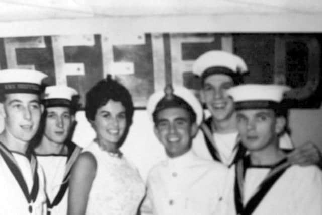 Eunice Gayson posing next to Petty Office Alan Walker and other crew members. Picture: Alan Walker