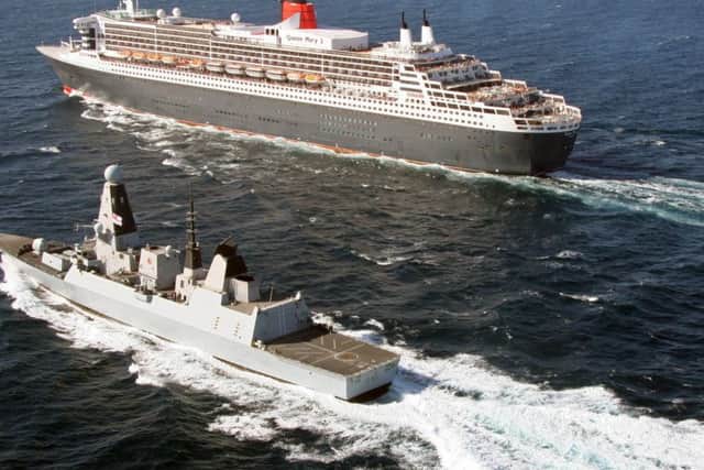 Ocean liner RMS Queen Mary II and Royal Navy warship HMS Defender
