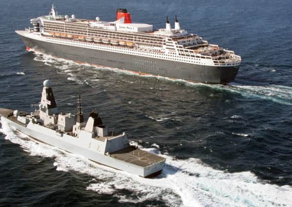 Ocean liner RMS Queen Mary II and Royal Navy warship HMS Defender