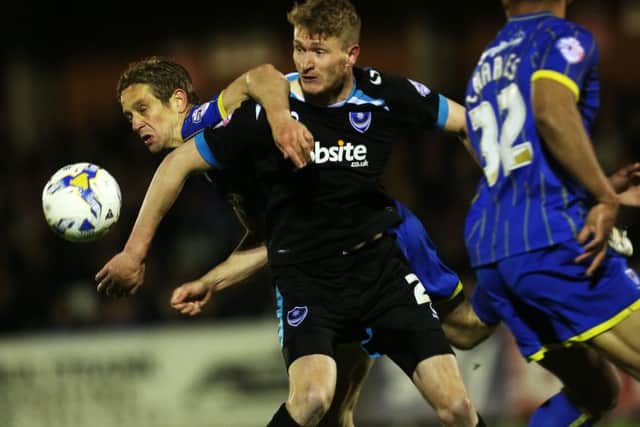 Pompey goal hero Michael Smith tussles with former Blues defender Paul Robinson. Picture: Joe Pepler