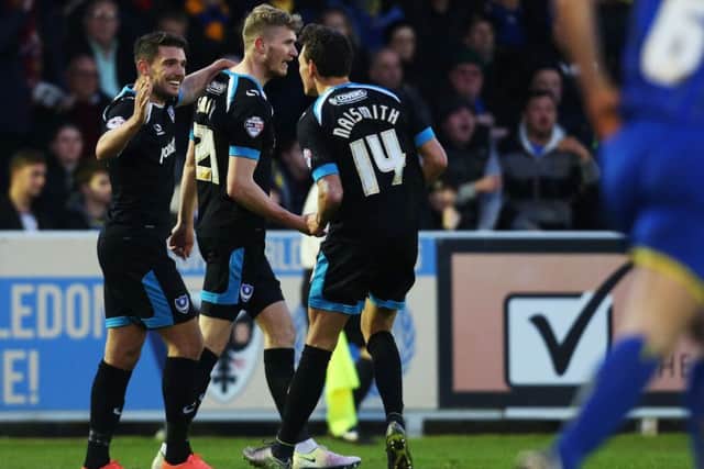 Michael Smith celebrates his goal with Gareth Evans, left, and Kal Naismith, right. Picture: Joe Pepler