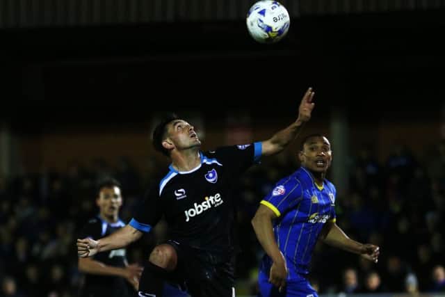 Gary Roberts keeps his focus for Pompey against Wimbledon. Picture: Joe Pepler