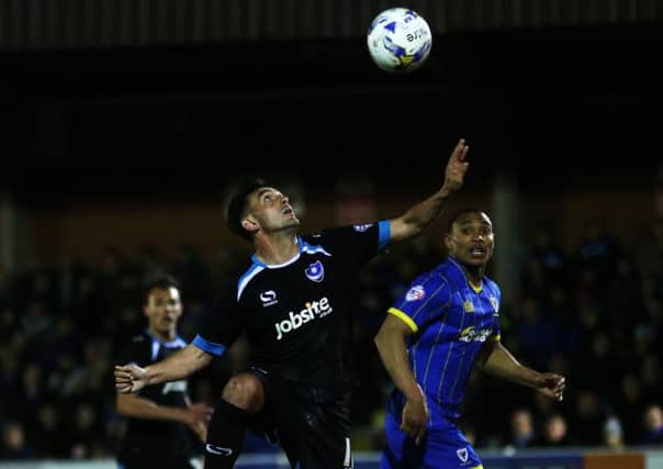 Gary Roberts keeps his focus for Pompey against Wimbledon. Picture: Joe Pepler