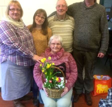 Carole Johnson (seated) with (behind, l to r) her daughter Helen, grand-daughter Kiera, husband Barry and son-in-law Steve
