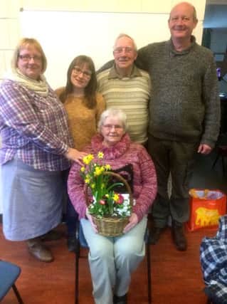 Carole Johnson (seated) with (behind, l to r) her daughter Helen, grand-daughter Kiera, husband Barry and son-in-law Steve