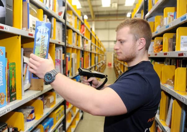 Dan Watson, 22, a supervisor at the new Amazon depot in Segensworth. 

Picture: Sarah Standing (160645-5194)