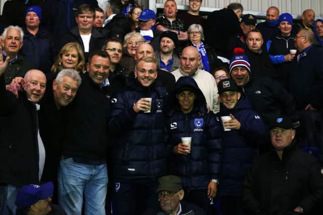 Jack Whatmough, Kyle Bennett and Conor Chaplin with Pompey fans at AFC Wimbledon. Picture: Joe Pepler