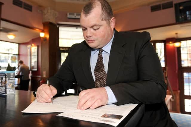 27/4/2016 (KB)An employment Open Day was held at The Isambard Brunel Kingdom pub in Guildhall Walk, Portsmouth on Wednesday. Pictured is: Grant Hardy (32) from Waterlooville, filling in an application form at the pub. Picture: Sarah Standing (160647-5269)