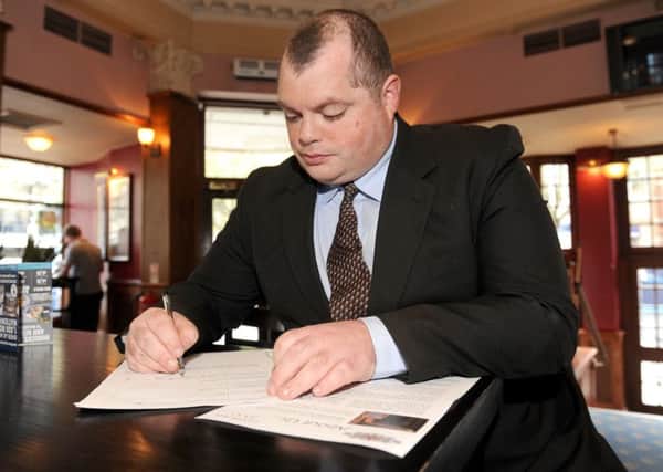 27/4/2016 (KB)
An employment Open Day was held at The Isambard Brunel Kingdom pub in Guildhall Walk, Portsmouth on Wednesday.
Pictured is: Grant Hardy (32) from Waterlooville, filling in an application form at the pub.
Picture: Sarah Standing (160647-5269)