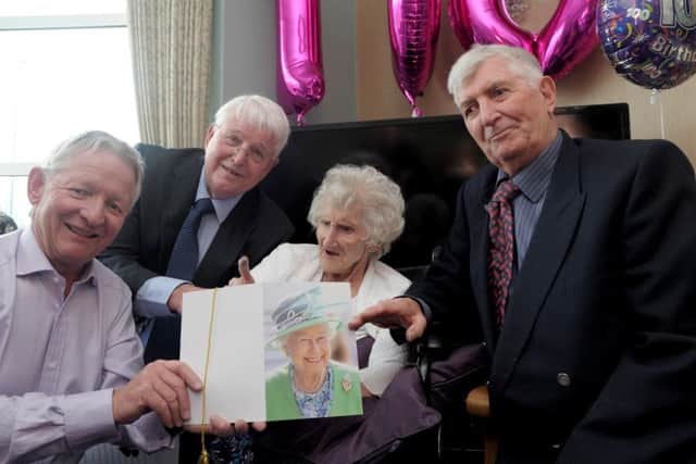 Pat Knight with her sons, L-R, Paul, 65, John, 74 and David, 77.