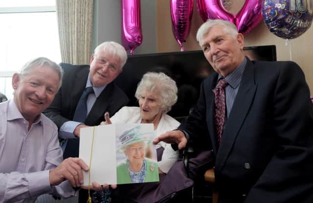 Pat Knight with her sons, L-R, Paul, 65, John, 74 and David, 77.