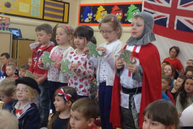Pupils dressed up as they sung the national anthem