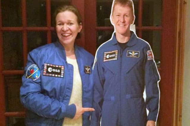 From left, Sam Mundell with a cardboard cutout of astronaut Tim Peake