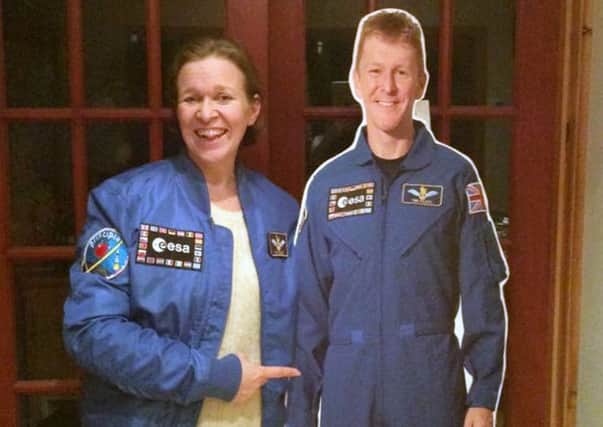 From left, Sam Mundell with a cardboard cutout of astronaut Tim Peake