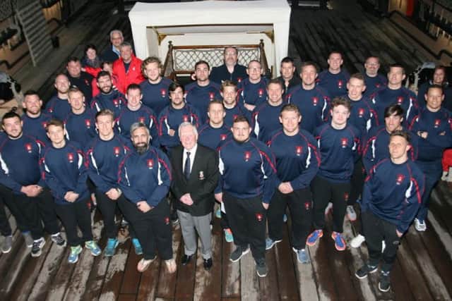 The Hampshire players, coaching staff and representatives on HMS Victory