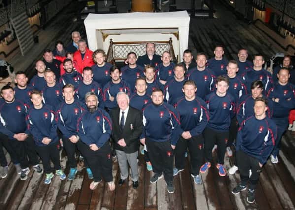 The Hampshire players, coaching staff and representatives on HMS Victory