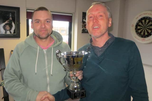Mike Talmondt receives the trophy from Cuestars director John Hunter. Picture: Tim Dunkley
