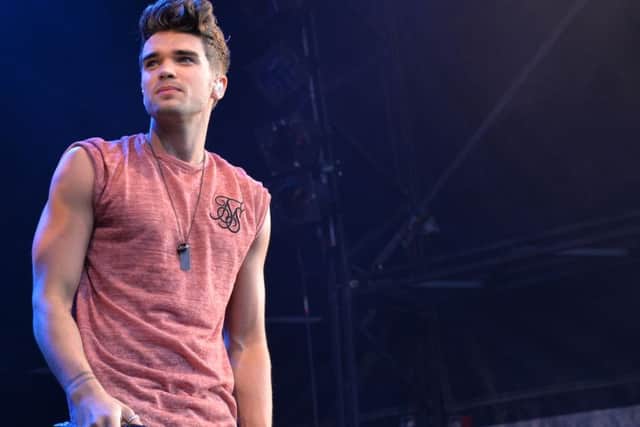 Josh Cuthbert on stage with Union J