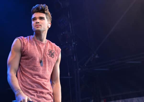 Josh Cuthbert on stage with Union J
