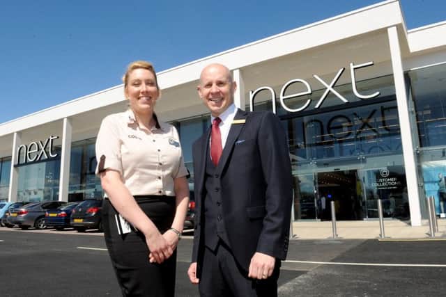 Costa manager Cheryl Price and Next manager Andrew Maitland outside the new store Picture: Sarah Standing (160649-5458)