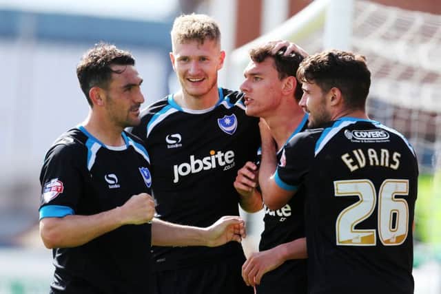 Michael Smith, second left, celebrates Kal Naismith's goal. Picture: Joe Pepler