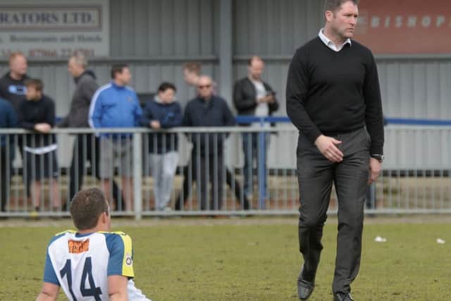Hawks boss Lee Bradbury cuts a dejected figure after their National League South relegation Picture: Mick Young