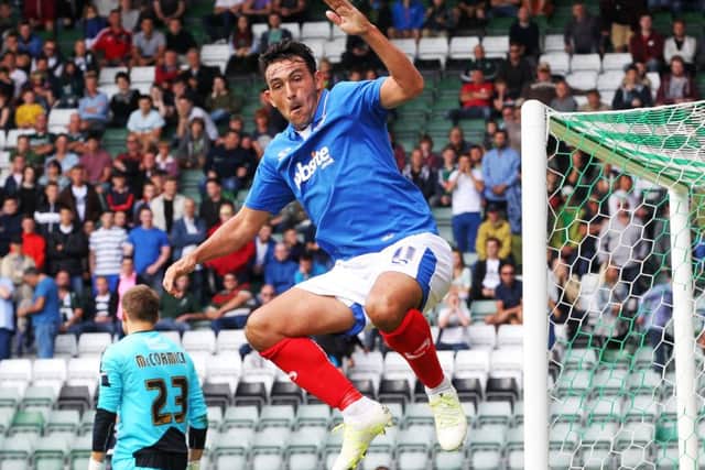 Gary Roberts celebrates scoring against play-off opponents Plymouth at Home Park back in August  a match the Blues won 2-1 Picture: Joe Pepler