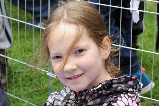 Bella Tomkinson, from Baffins, enjoys cuddles with one of the rabbits (160655-6176)