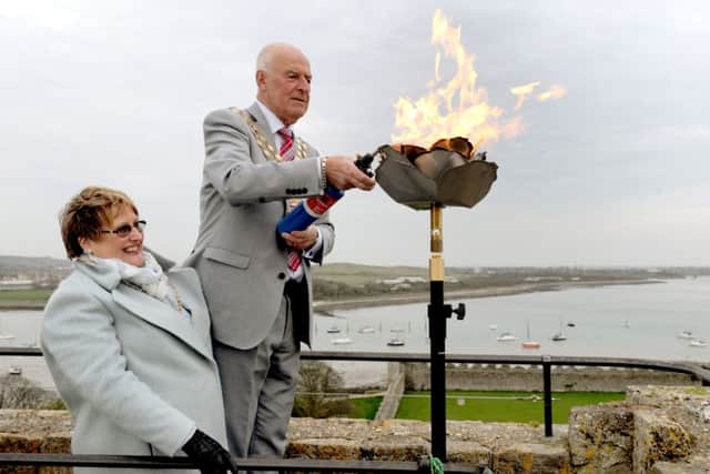 Anne and Mike Ford at the recent lighting of the Beacon on the keep at Portchester Castle in celebration of Her Majestys 90th birthday.Picture: Sarah Standing (160634-4563)