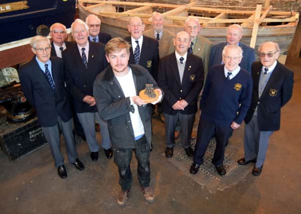 Richard Atherton of Petersfield, the first winner of the award funded by the Association of Royal Naval Shipwrights, flanked by members of the group