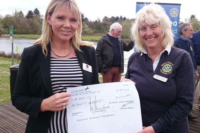 The Haven community fundraiser Heidi Rehman with Dragon Boat Festival organiser Carol Jenkinson with a cheque for Â£1,200 raised for The Haven at last year's boat race
