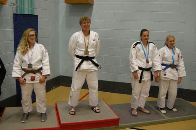 Sarah Hopkins on top of the podium