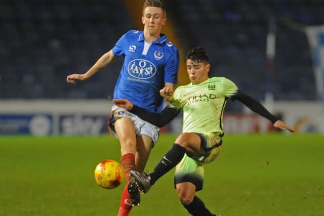 Adam May, left, in FA Youth Cup action for Pompey Academy against Manchester City     Picture: Ian Hargreaves