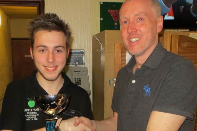 Mark Lloyd picks up his trophy from Cuestars director John Hunter. Picture: Tim Dunkley