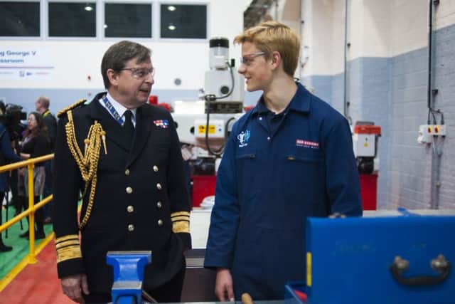 Vice Admiral Jonathan Woodcock, OBE, Royal Navy, chats with one of BAE Systems apprentices during a tour of the refurbished Skills Development Centre in Portsmouth Naval Base Picture: BAE Systems