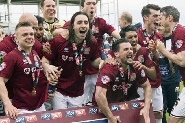 Northampton celebrate winning League Two Picture: Kirsty Edmonds