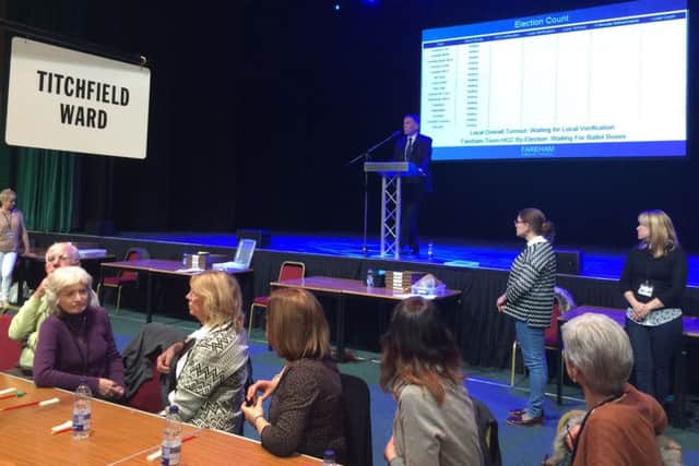Borough council chief executive Peter Grimwood opening the count in Fareham
