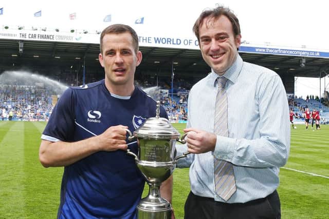Michael Doyle, left, is presented with The News/Sports Mail Pompey Player of the Season award by News chief sports writer Neil Allen Picture: Joe Pepler