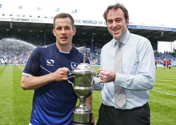 Michael Doyle, left, is presented with The News/Sports Mail Pompey Player of the Season award by News chief sports writer Neil Allen Picture: Joe Pepler