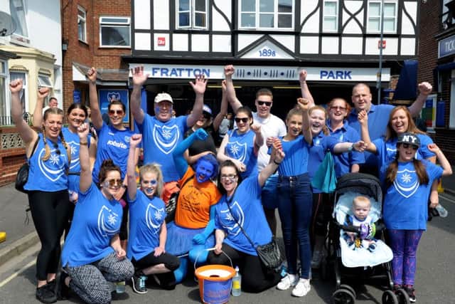 7/5/16Blue Day fundraising walkers leave Fratton Park, heading for Gunwharf Quays along an 8 mile route.Picture: Paul Jacobs (160250-2) PPP-160705-185613006