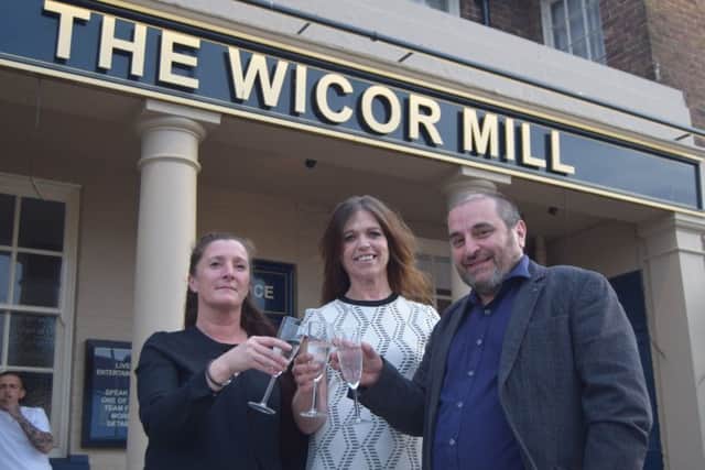 It's cheers all round with, from the left, chef Teresa Ross, manager Lorraine Lundbech and owner Steve Hudson