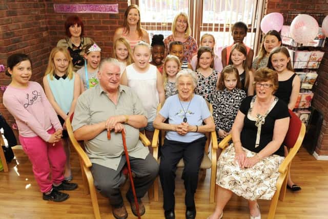 Joyce Snow celebrated her 100th birthday with a surprise party featuring a visit by Milton Park Primary School Choir