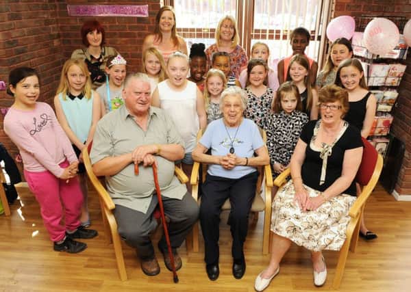Joyce Snow celebrated her 100th birthday with a surprise party featuring a visit by Milton Park Primary School Choir