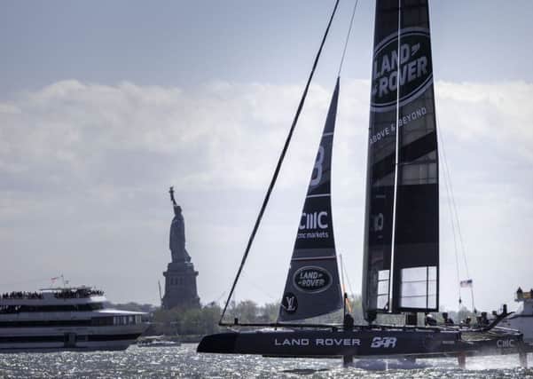 Land Rover BAR sail past the Statue of Liberty Picture: Harry KH/Land Rover BAR