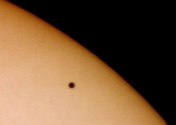This image of a tiny Planet Mercury transiting across the face of the Sun was taken on 7 May 2003 using a digital camera attached to an ETX90 telescope. Photograph by Jamie Cooper.  (Photo by SSPL/Getty Images)